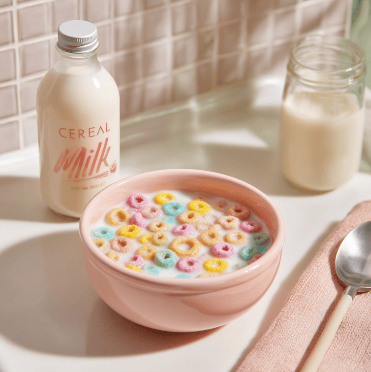 Bowl of cereal with milk beside a bottle of cereal milk, representing the rise of the flavor trend