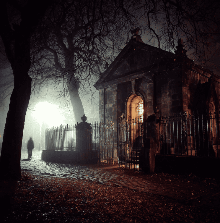 Fog-shrouded Greyfriars Kirkyard with the Black Mausoleum, associated with the Mackenzie Poltergeist.