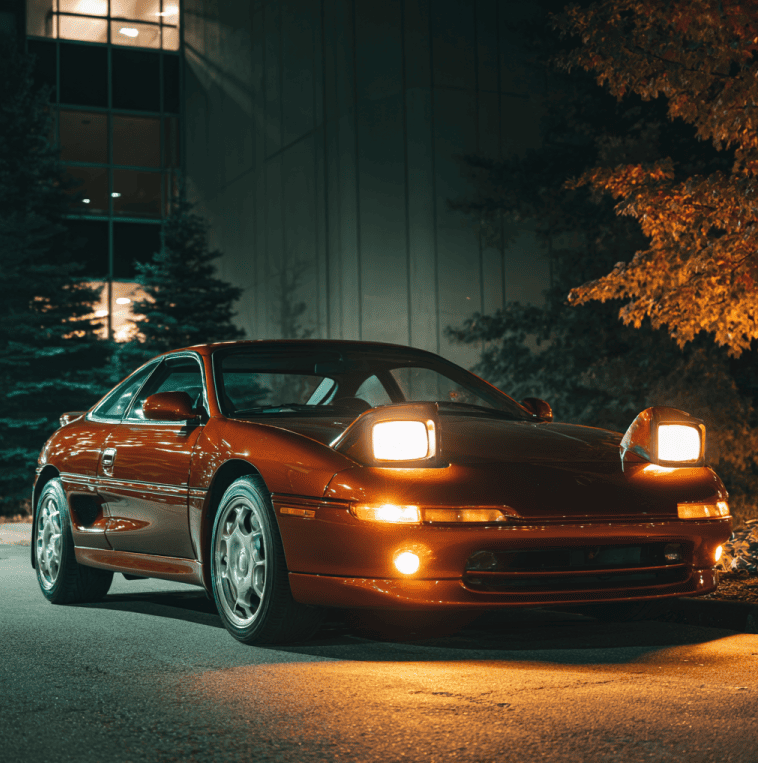 Pop up headlights raised on a 1990s sports car, illustrating how federal lighting and safety standards led to their disappearance.