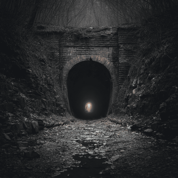 Ghostly lantern glow inside the abandoned Moonville Tunnel in Ohio
