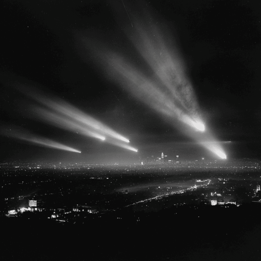 Searchlights converging on a glowing object during the 1942 Battle for Los Angeles.