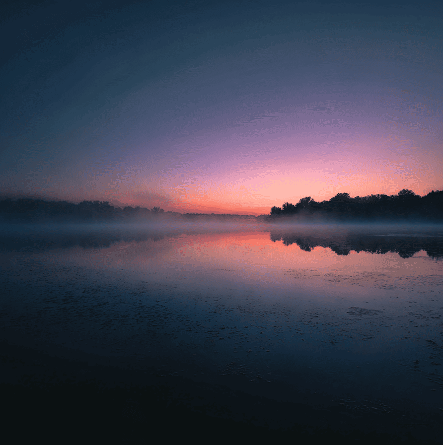 Fog-covered Michigan lake with a subtle human shape beneath the water, representing the 1941 Diving Bell Man mystery.