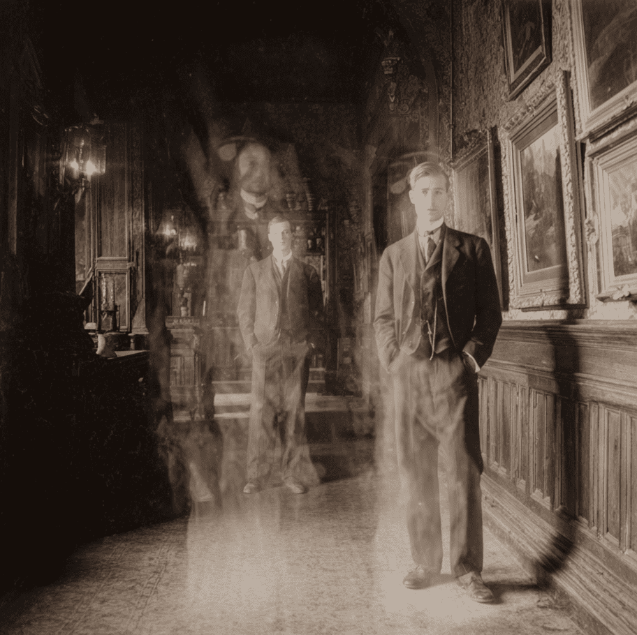 Visitor standing inside Baleroy Mansion with an unknown man appearing beside them only in the photograph, illustrating the Phantom Photographer legend.