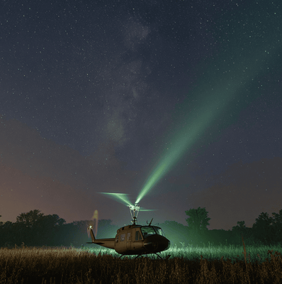 A UH-1 Huey helicopter encountering a silent UFO emitting a green beam during the 1973 Coyne incident.