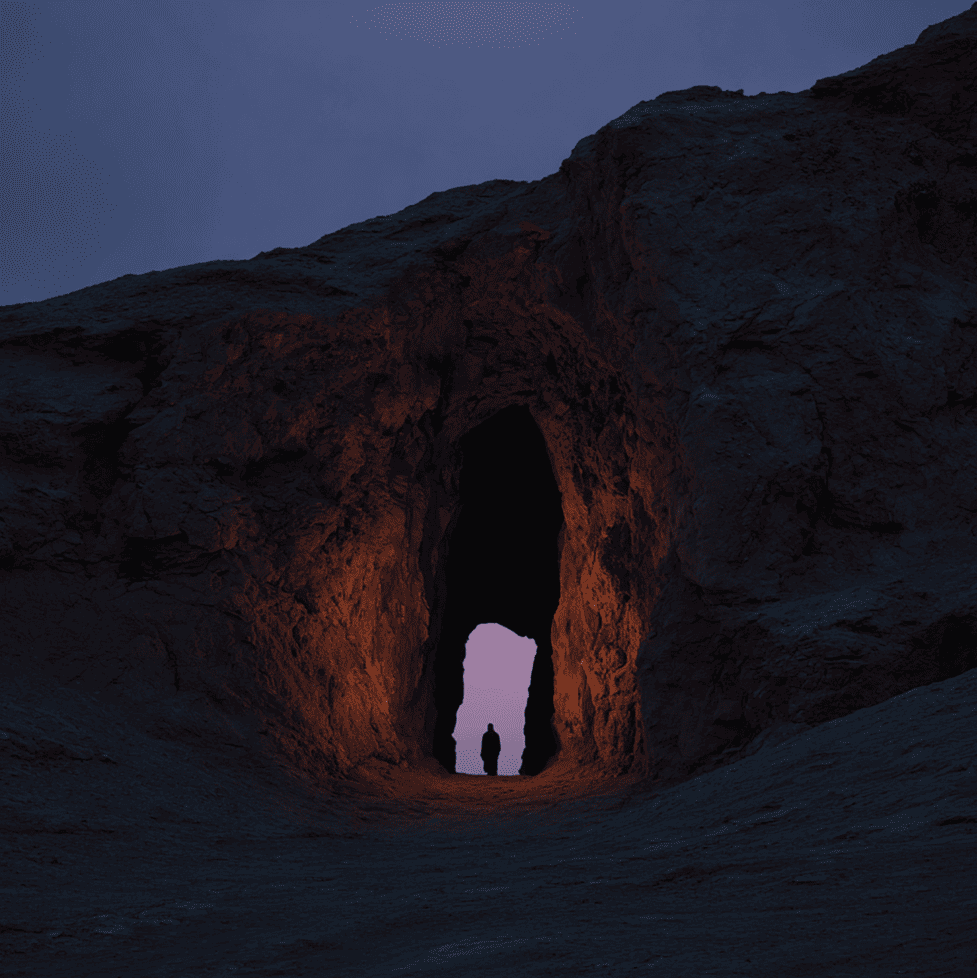 Shadowy cave opening in the mountains of Afghanistan with a faint giant like form inside, representing the Kandahar giant myth.