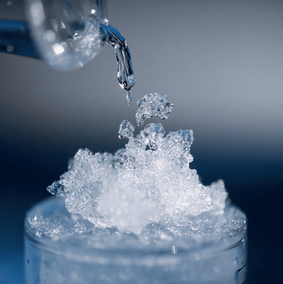 Supersaturated sodium acetate forming instant white crystals known as hot ice.