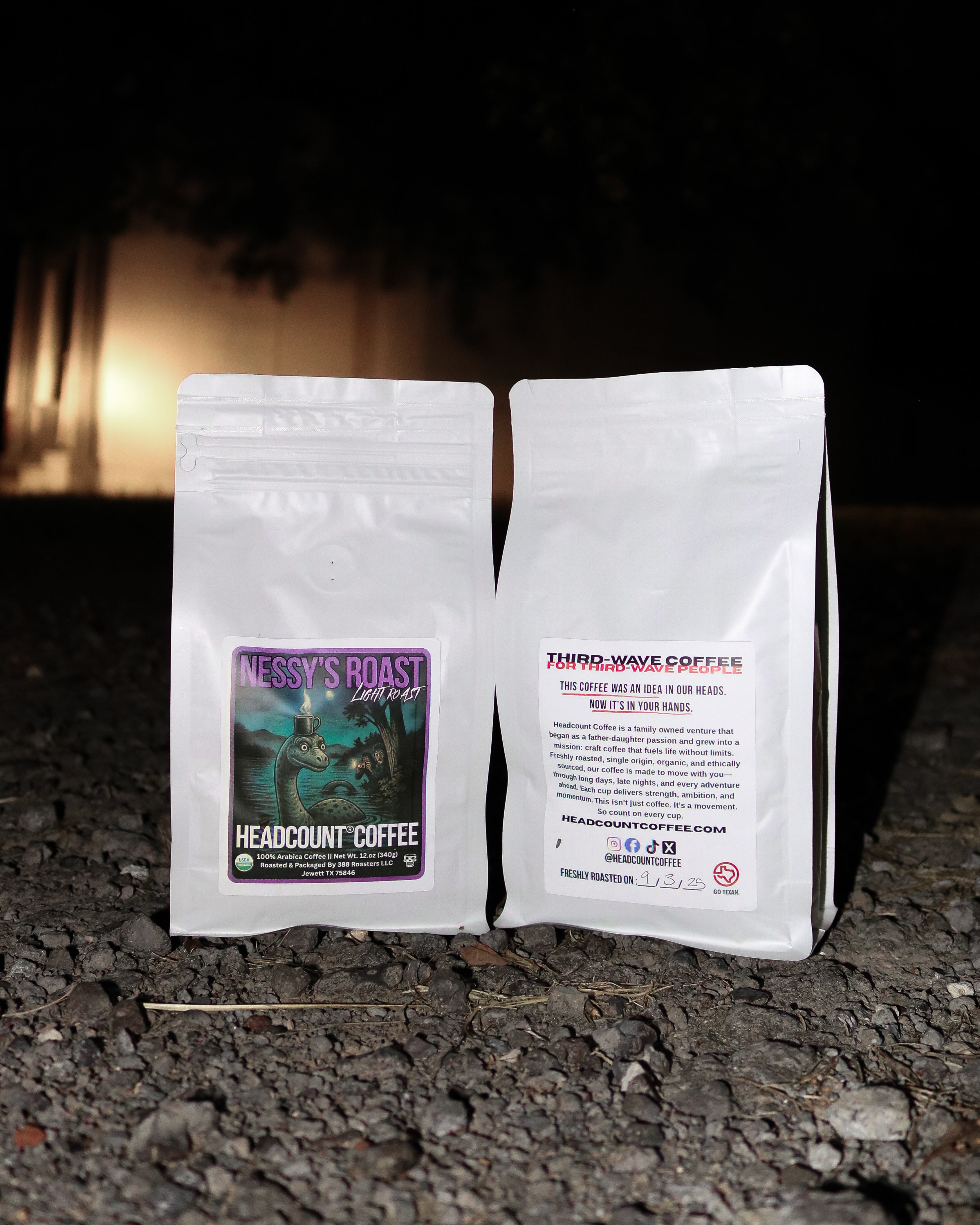 Headcount Coffee Nessy’s Roast light roast organic coffee bags from Texas coffee roastery displayed outdoors at night.